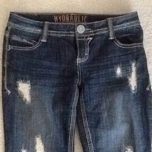 Slightly  ripped blue jeans , skin not exposed